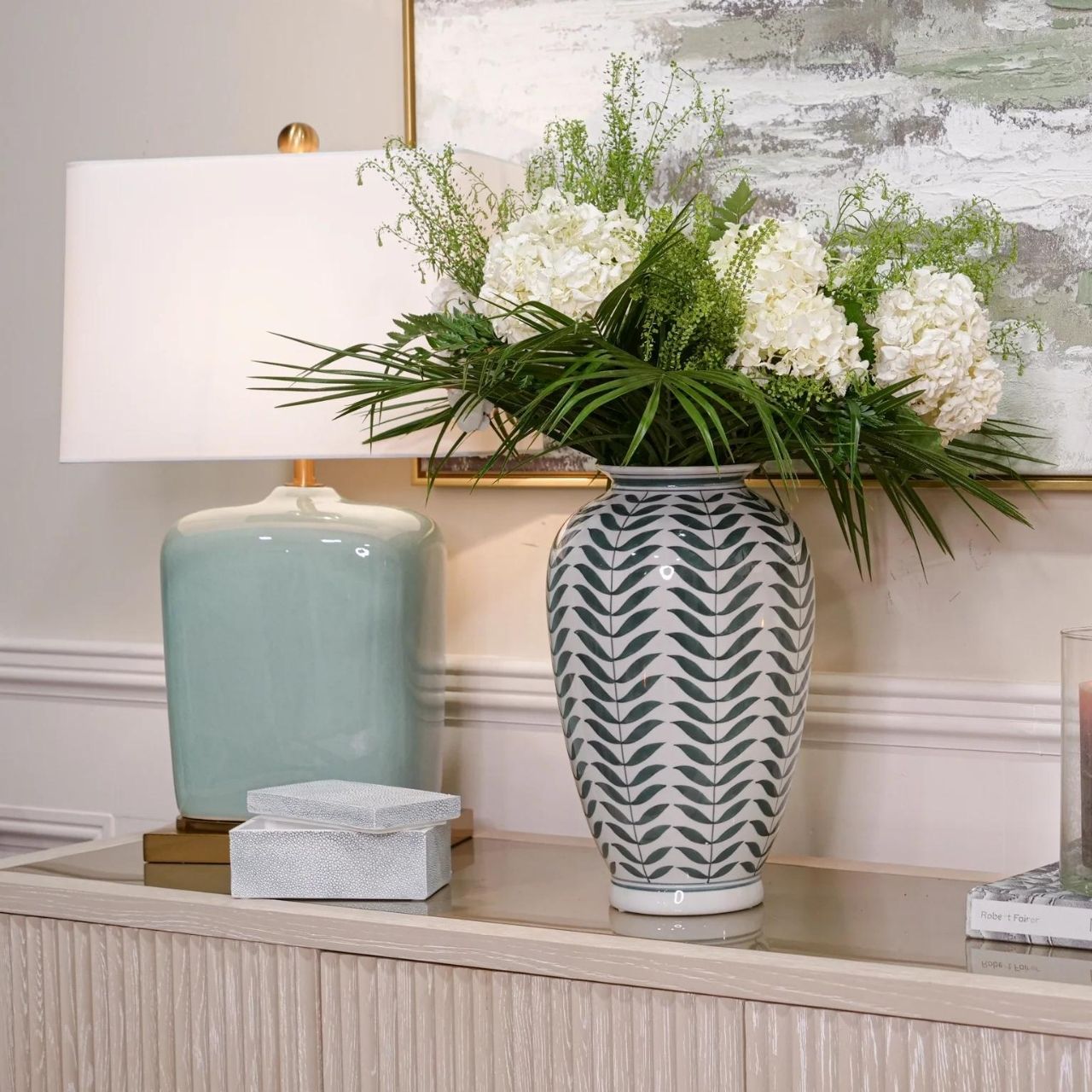 Leaf Vase by Mindy Brownes  This gorgeous ceramic decorative vase will add a delicate pop of colour to your home. The calming colour pallet with it's off white base and green leaf pattern will make this the perfect spring home accessory.