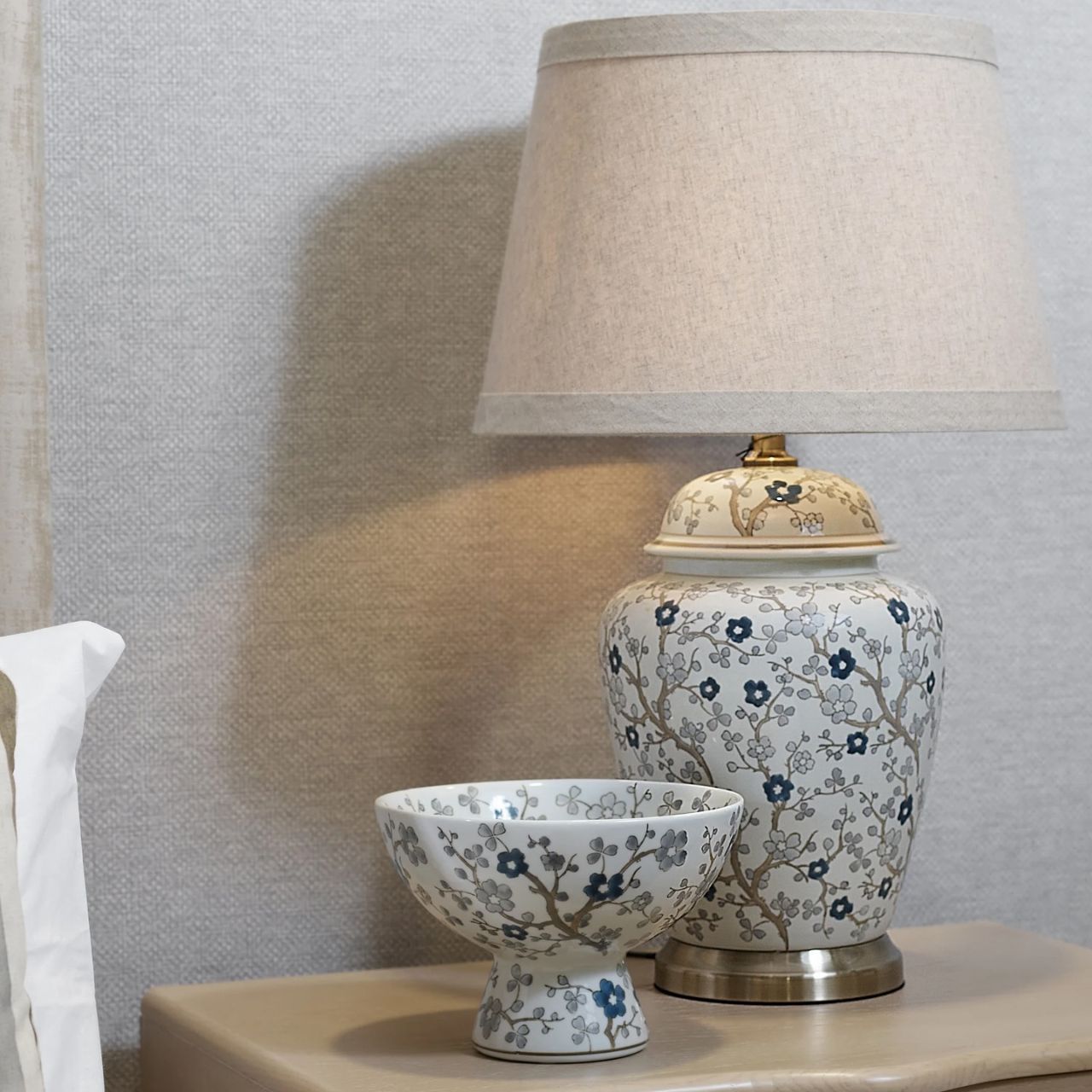 Enhance your décor with the Tiya Bowl. Its elegant floral design, featuring beautiful blue flowers, adds a touch of sophistication to any table setting or shelf.