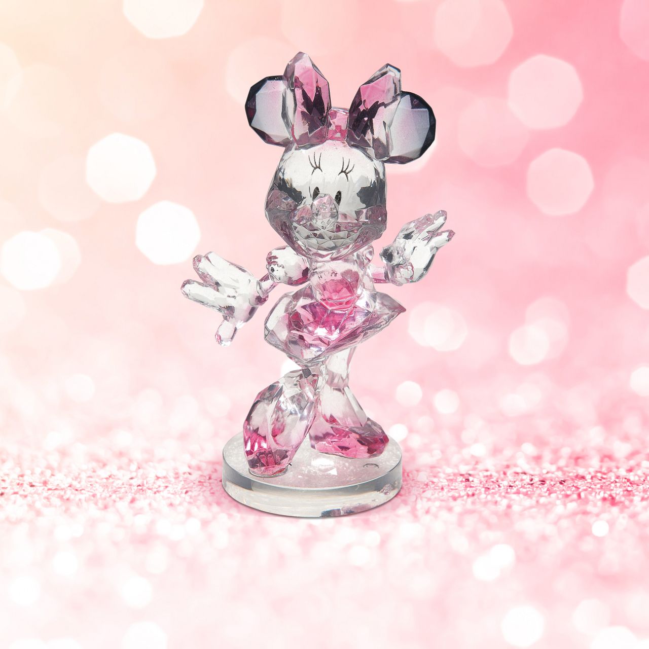 Disney Facets Minnie Mouse Celebrate your love for Disney with this "gem-cut" acrylic sculpture of your favourite Disney character: Minnie Mouse. The long time girlfriend of Mickey Mouse, she is known for her sweet personality, large head bows and polka-dotted dresses.