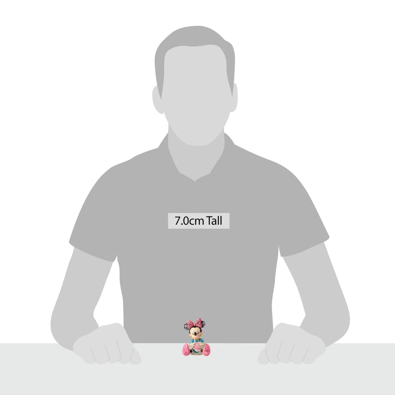 Disney Showcase Minnie Mouse with Heart Mini Figurine Beautifully handcrafted with delightful attention to detail, Jim Shore's charming miniatures capture the essence of the beloved Disney characters. Making a wish on a heart held close, this beguiling Minnie is a heartfelt and playful romantic design.