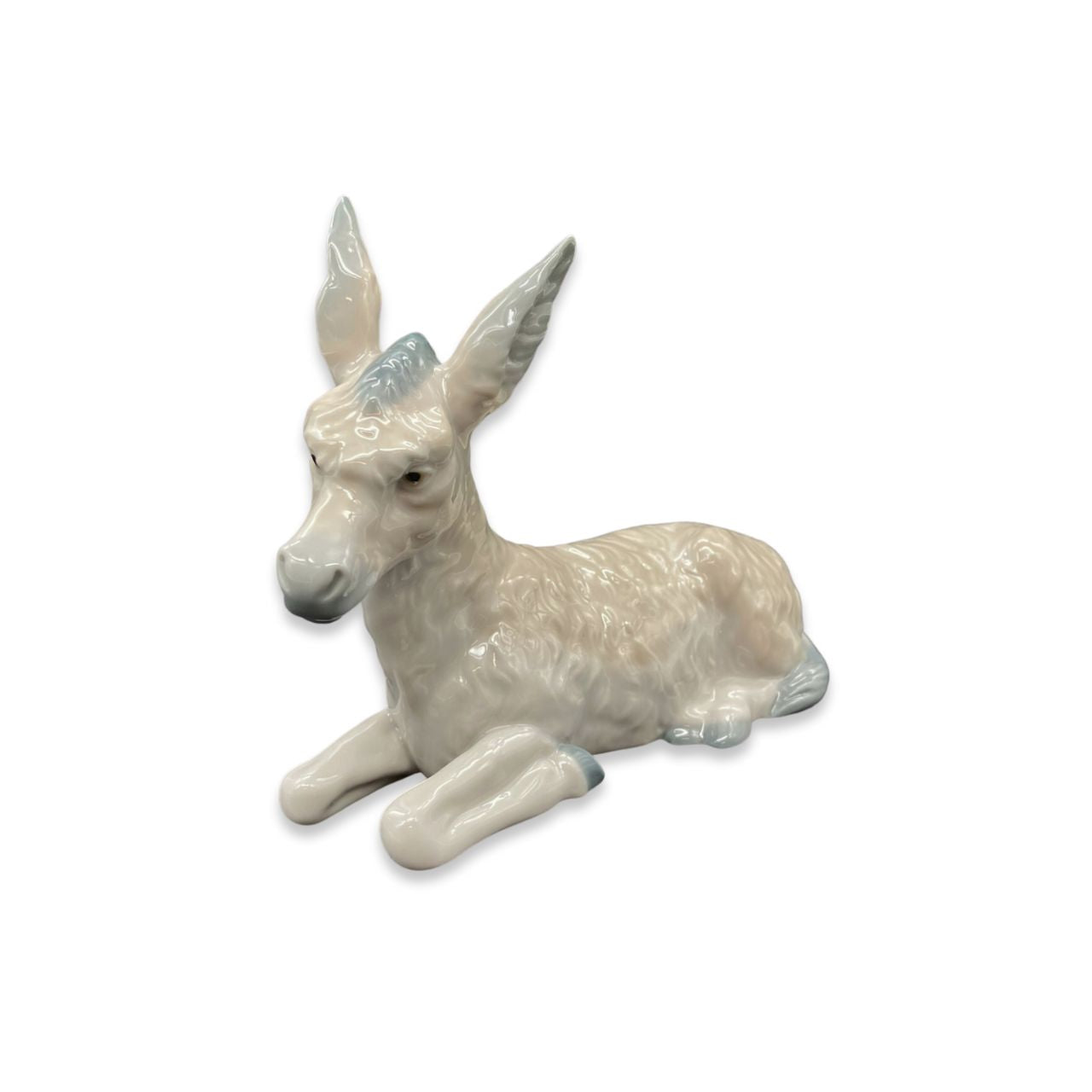 Nao by Lladro Nativity Donkey Nao porcelain figurine “Donkey” from the Christmas Collection. Sculpted by Salvador Furió, this figurine is part of the nativity set.