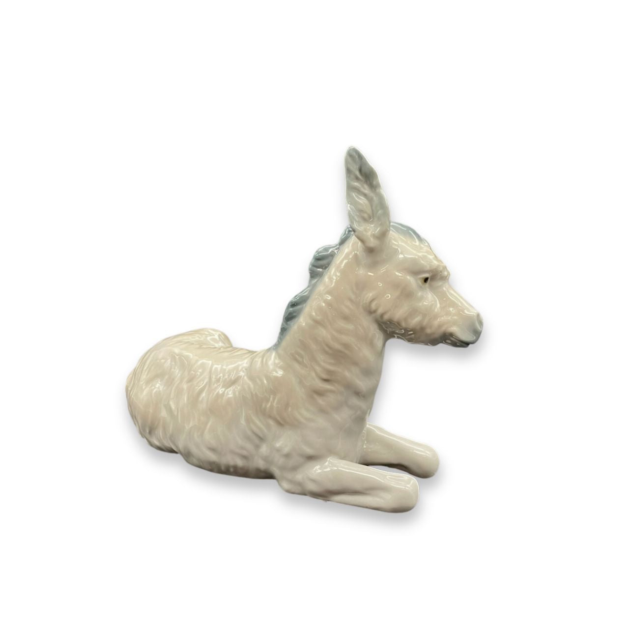 Nao by Lladro Nativity Donkey Nao porcelain figurine “Donkey” from the Christmas Collection. Sculpted by Salvador Furió, this figurine is part of the nativity set.