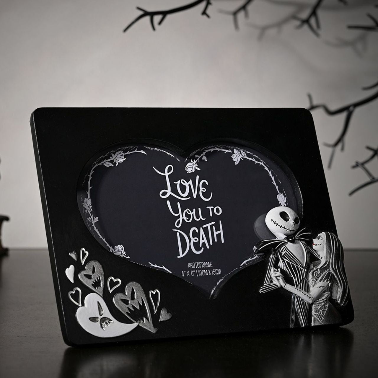 Declare your love with a spooky twist using this Disney The Nightmare Before Christmas picture frame. Featuring Jack Skellington, bats, and a large heart-shaped centerpiece, it's the perfect gift for fans of the classic film.