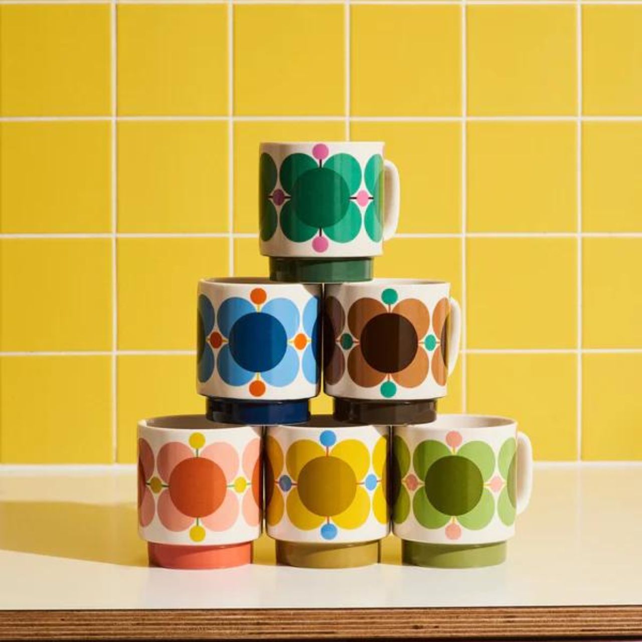 Orla Kiely Set 6 Stacking Mugs - Atomic Flower  DESIGNED IN THE UK BY ORLA KIELY: This set of six mugs has a unique 'Atomic Flower' print and is designed to be stacked.  Each mug is stamped with an authentic Orla Kiely logo.