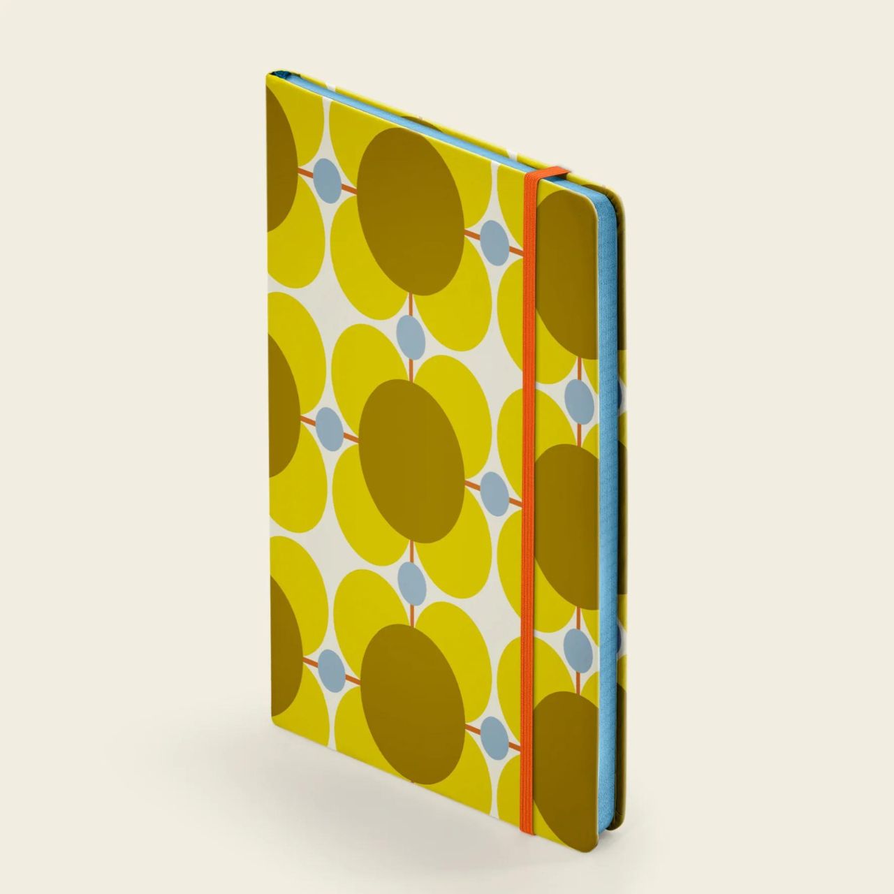 Orla Kiely Medium Notebook - Atomic Flower  Organize your goals, plans, and weekly shopping list in a sleek and stylish manner with our Atomic Flower notebook. Featuring a sturdy hardcover, rounded corners, elastic closure, and matching ribbon bookmark, this notebook also includes a grid square paper layout and an expandable inner back pocket.