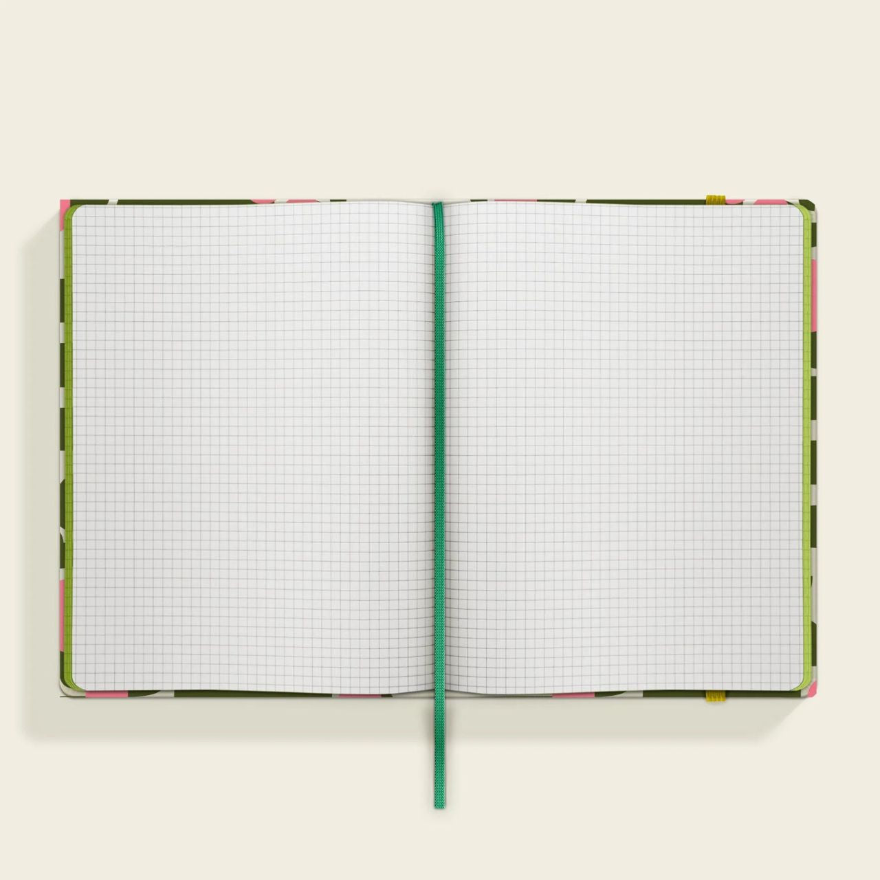 Orla Kiely Medium Notebook - Dog Show  Organize your goals, plans, and weekly shopping list in a sleek and stylish manner with our Dog Show notebook. Featuring a sturdy hardcover, rounded corners, elastic closure, and matching ribbon bookmark, this notebook also includes a grid square paper layout and an expandable inner back pocket.