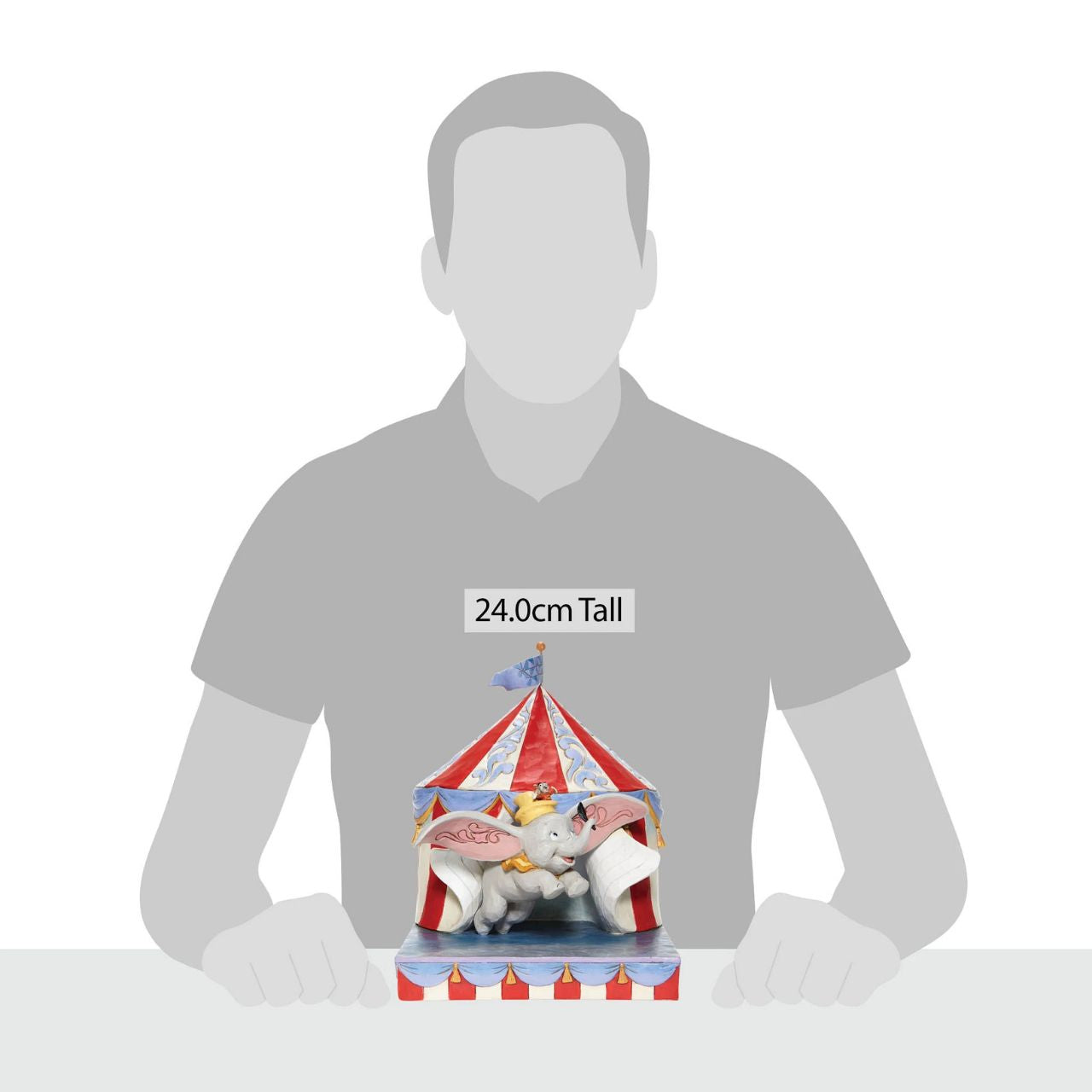 Jim Shore Over the Big Top - Dumbo Circus out of Tent Figurine With Timothy's encouragement, guidance, and the willingness from a feather, Dumbo takes his favourite friend on an adventurous flight. This Disney piece by Jim Shore is intricately hand-painted and detailed with folk art motifs and is great for any Dumbo fan.