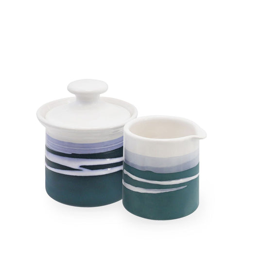 Tipperary Crystal Paul Maloney Pottery Teal Milker & Sugar Bowl  This Paul Maloney Pottery Teal Milker & Sugar Bowl is a perfect addition to any kitchen. Crafted from the highest quality materials, this set provides both convenience and style. The teal color is sure to complement any table or countertop. Use it to store small items or to add decoration to your kitchen.