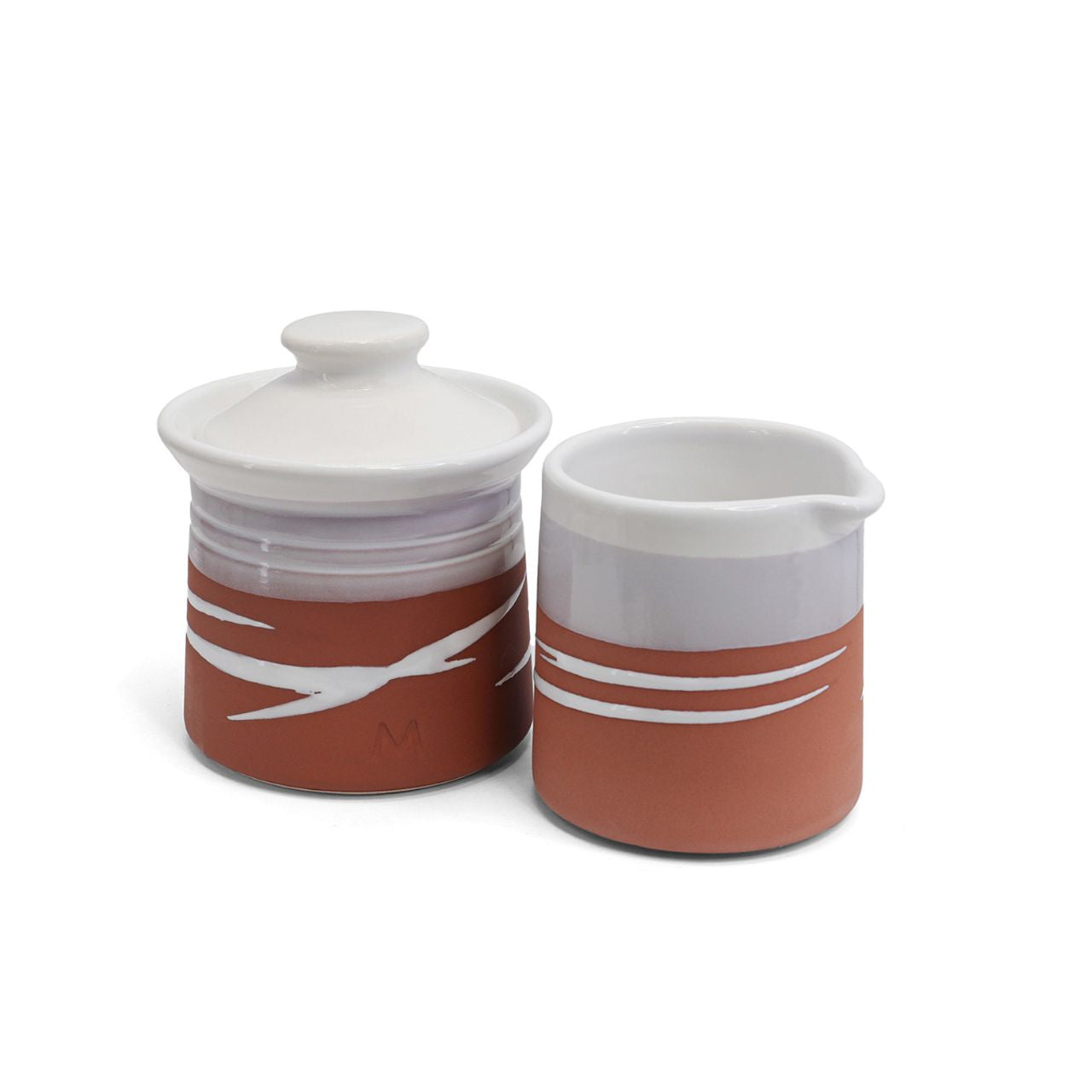 This Paul Maloney Pottery Terracotta Milker & Sugar Bowl is a perfect addition to any kitchen. Crafted from the highest quality materials, this set provides both convenience and style. The Terracotta colour is sure to complement any table or countertop. Use it to store small items or to add decoration to your kitchen.