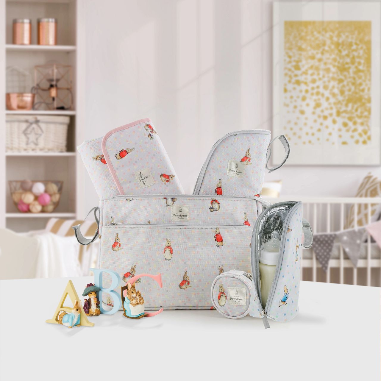 Beatrix Potter Peter Rabbit Insulated Bottle Bag Our portable classic Peter Rabbit insulated bottle bag makes feeding on the go easy. Can be used to keep bottles hot or cold, ideal for your hungry little rabbit. The adorable design ensures it fits perfectly on your wrist, pram or bag. The design allows this bottle bag to be gender-neutrals and perfect for any baby shower gift.