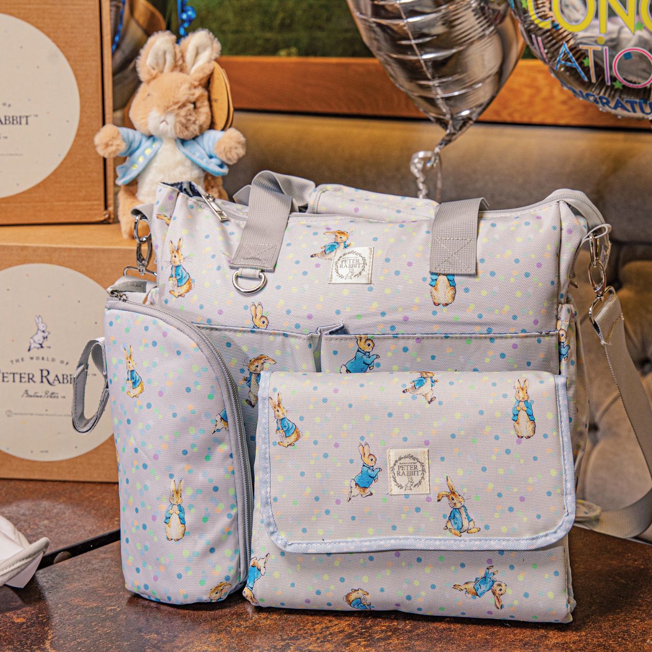 Beatrix Potter Peter Rabbit Insulated Bottle Bag Our portable classic Peter Rabbit insulated bottle bag makes feeding on the go easy. Can be used to keep bottles hot or cold, ideal for your hungry little rabbit. The adorable design ensures it fits perfectly on your wrist, pram or bag. The design allows this bottle bag to be gender-neutrals and perfect for any baby shower gift.