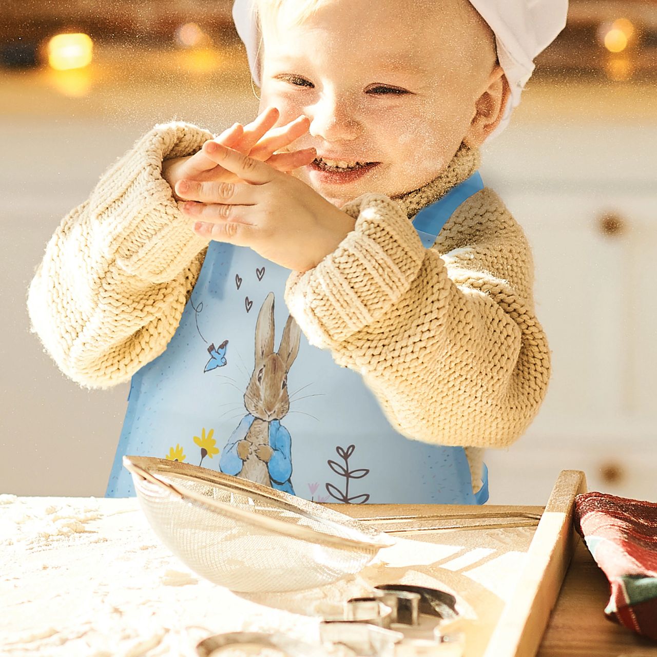 Introducing the delightful Peter Rabbit apron, designed to make every cooking or crafting adventure a memorable one. Crafted with a super soft, wipeable fabric, it ensures easy clean-up, while the hook & loop tape fastening on the neck tie offers extra safety and comfort for your little one.