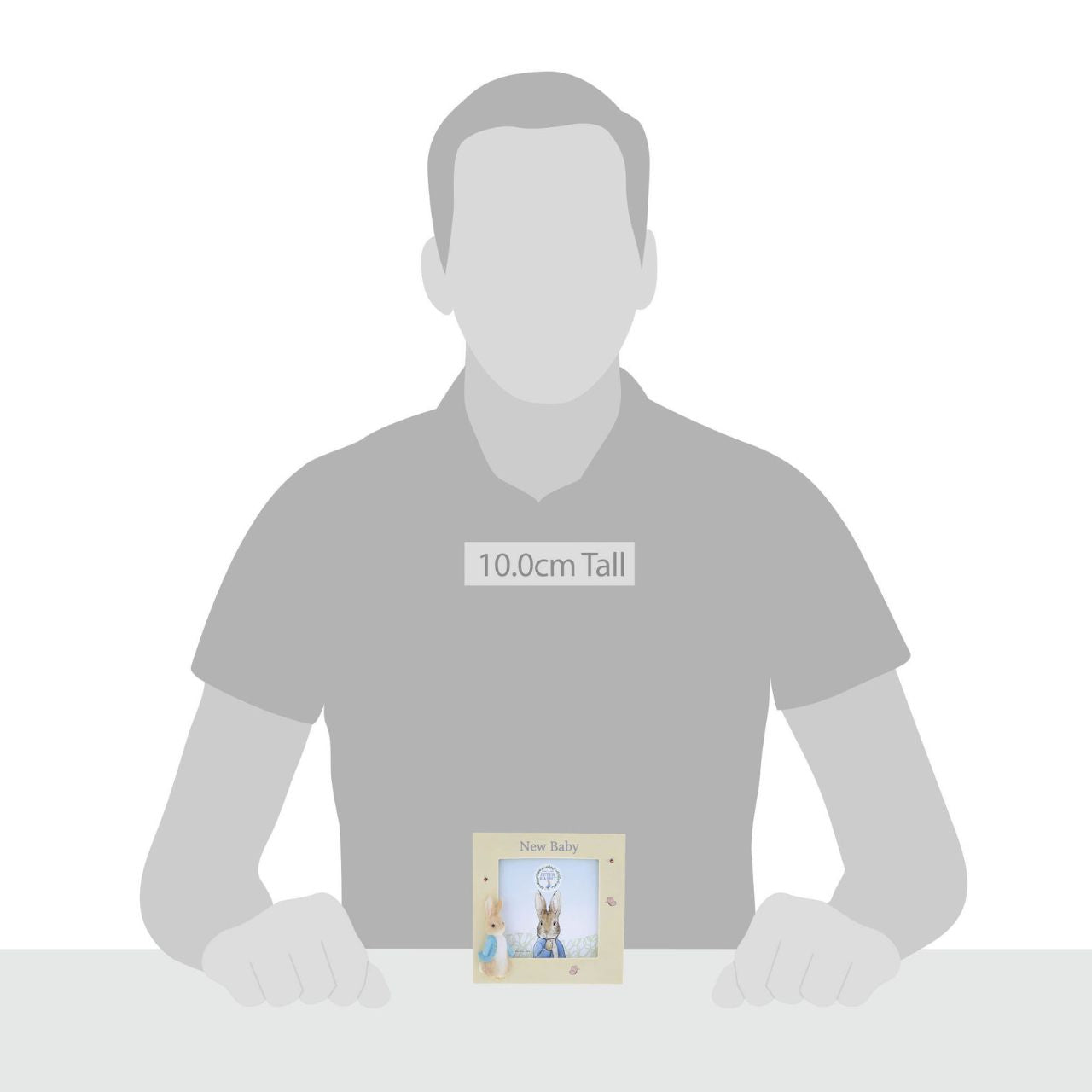 Peter Rabbit New Baby Photo Frame Celebrate a new bundle of joy with this Peter Rabbit new baby photo frame, a perfect way to display a treasured photo. Complete with original illustrations from the Beatrix Potter stories. Photo frame fits square sized photos.