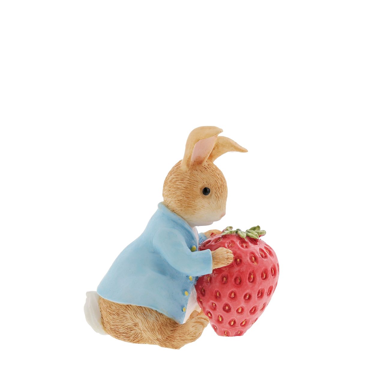 Beatrix Potter Peter Rabbit with Strawberry Figurine  Our mischievous and lovable bunny is ready to munch his way through this gigantic strawberry. This unique pose makes a treasured keepsake or gift for a Peter Rabbit lover. Created from newly drawn artworks helping to bring the featured character to life.