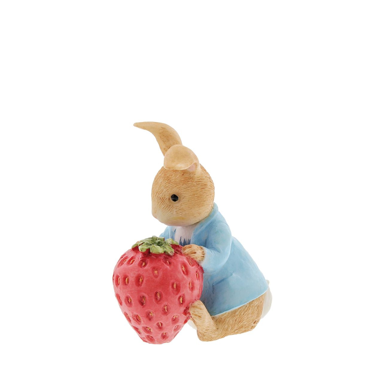 Beatrix Potter Peter Rabbit with Strawberry Figurine  Our mischievous and lovable bunny is ready to munch his way through this gigantic strawberry. This unique pose makes a treasured keepsake or gift for a Peter Rabbit lover. Created from newly drawn artworks helping to bring the featured character to life.