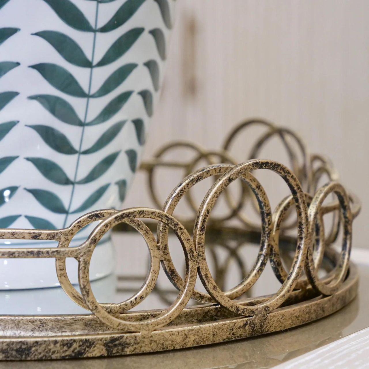 Mindy Brownes Remy Trays Set of 2 Set of two mirrored trays, Serve your drinks or nibbles in style on this deco mirror tray. Beautifully constructed from glass and metal, it's sure to make an impact. Antique gold in finish.