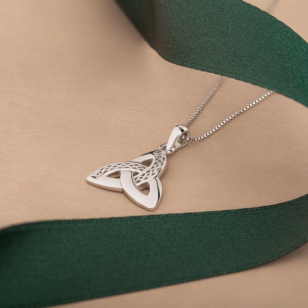 This timeless sterling silver pendant features the iconic Trinity Knot, and has been Irish hallmarked in Dublin Castle. The Trinity Knot dates back to monks who worked tirelessly to illustrate the gospels, with the circular design (with no beginning and no end) representing eternal life and endless love. This unique knot-work design in this pendant is featured on both sides of the piece. This sterling silver piece would make a perfect gift for someone you love.