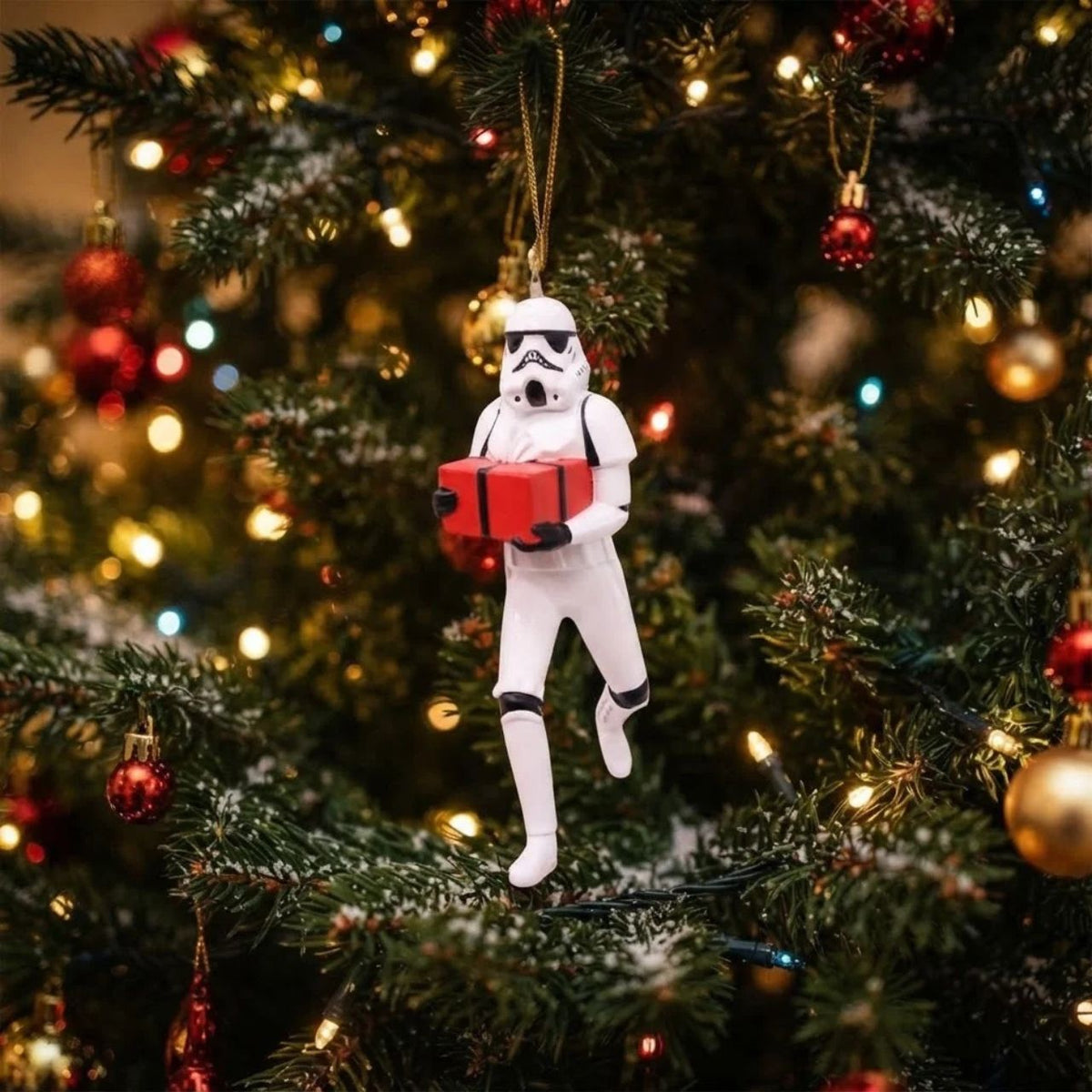 Bring iconic Star Wars style to your Christmas tree with this charming Stormtrooper Present ornament. Standing 10 cm tall, this festive hanging decoration features the beloved character clutching a gift, perfect for fans of the galaxy far, far away.