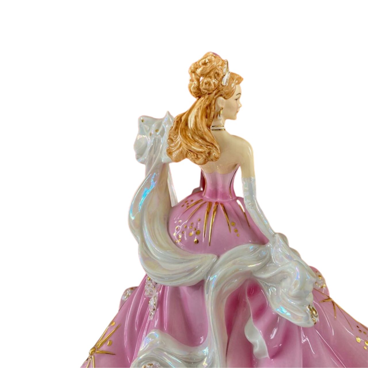 English Ladies Sweet Radiance  From our English Ladies Co Radiance Collection, the Sweet Radiance figurine. This figurine has been modelled by Valerie Annand and hand-painted and decorated by our Master Painter Dan Smith. The Sweet Radiance figurine comes in a light floral pink colourway and has been detailed with Mother of Pearl lustre and real gold highlights.