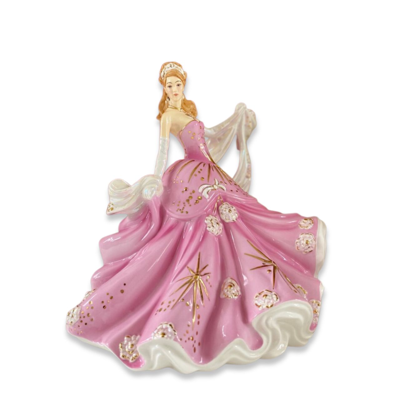 English Ladies Sweet Radiance  From our English Ladies Co Radiance Collection, the Sweet Radiance figurine. This figurine has been modelled by Valerie Annand and hand-painted and decorated by our Master Painter Dan Smith. The Sweet Radiance figurine comes in a light floral pink colourway and has been detailed with Mother of Pearl lustre and real gold highlights.
