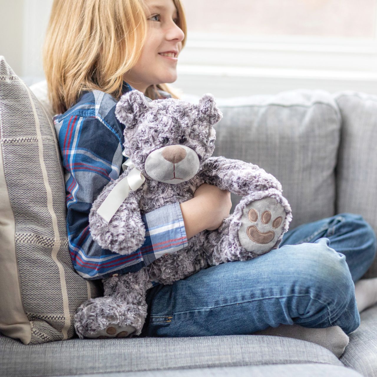 Introduce a touch of luxury to your product lineup with Teddy McBearsley, a perfect blend of elegance and comfort. This bear features exquisite textured fur and a classic satin ribbon, making it an ideal choice for premium gift selections and upscale displays.