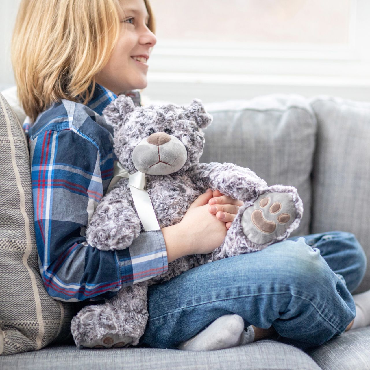 Introduce a touch of luxury to your product lineup with Teddy McBearsley, a perfect blend of elegance and comfort. This bear features exquisite textured fur and a classic satin ribbon, making it an ideal choice for premium gift selections and upscale displays.
