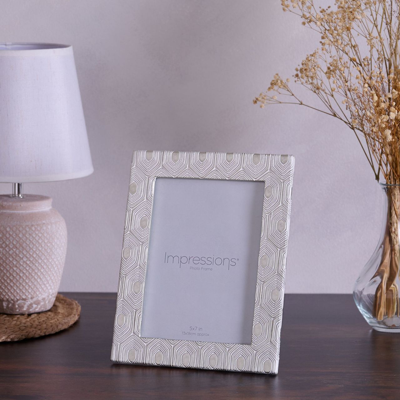 This attractive frame will enhance both the photographs within it and the room it sits within.