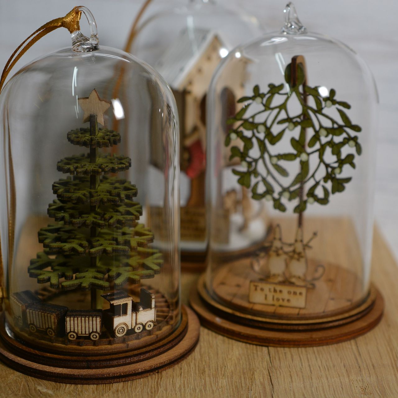 The One I Love at Christmas Hanging Ornament The Spirit of Christmas. A collection of delightful wooden decorations that capture the essence of that special time of year. This glass dome, Christmas decoration encases two happy little mice, adorned under a large amount of Christmas Mistletoe and finished with ribbon to help hang off your Christmas tree.