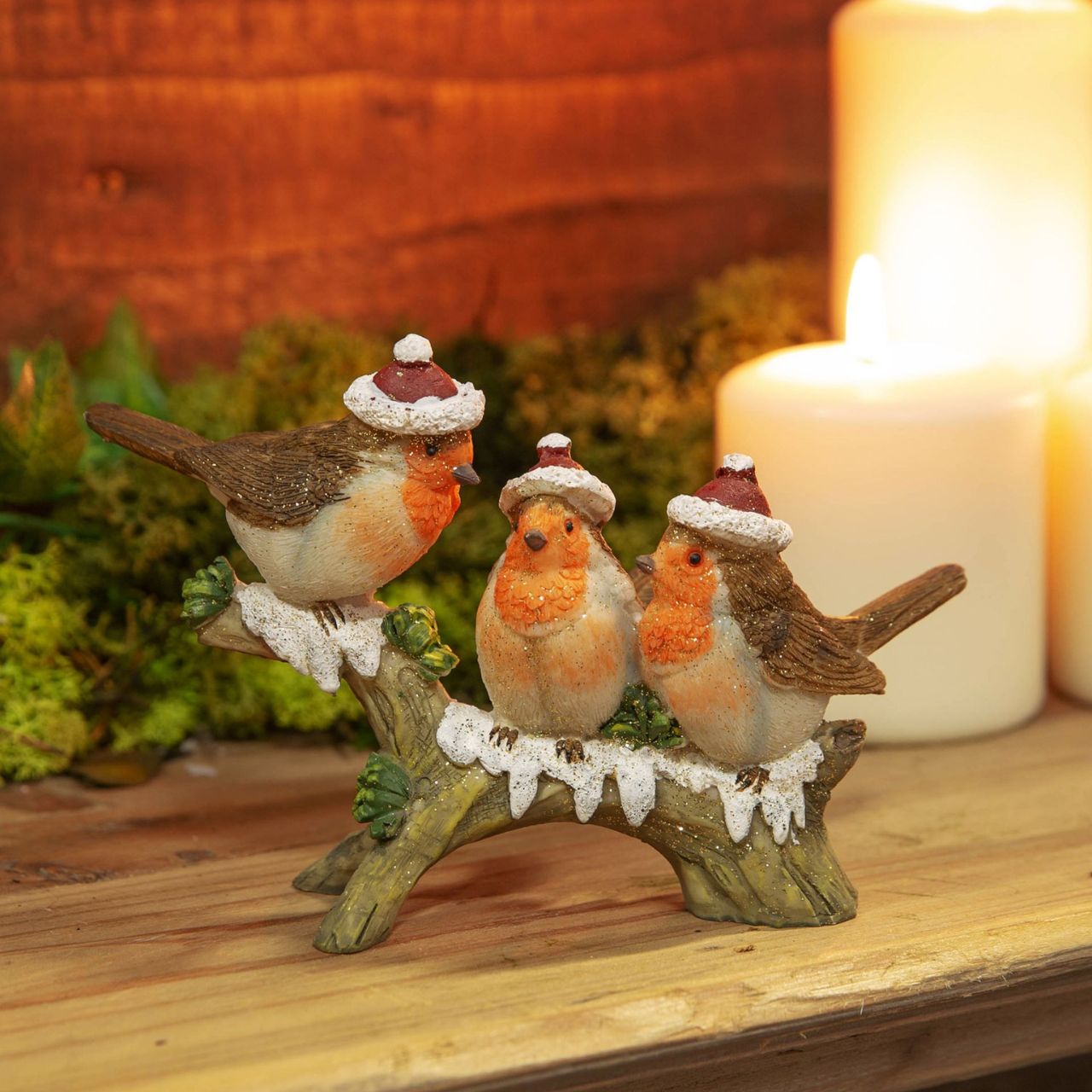 A hand painted three robins on a branch figurine. From the Enchanted Forest collection by Santa's Workshop - create your own winter wonderland.