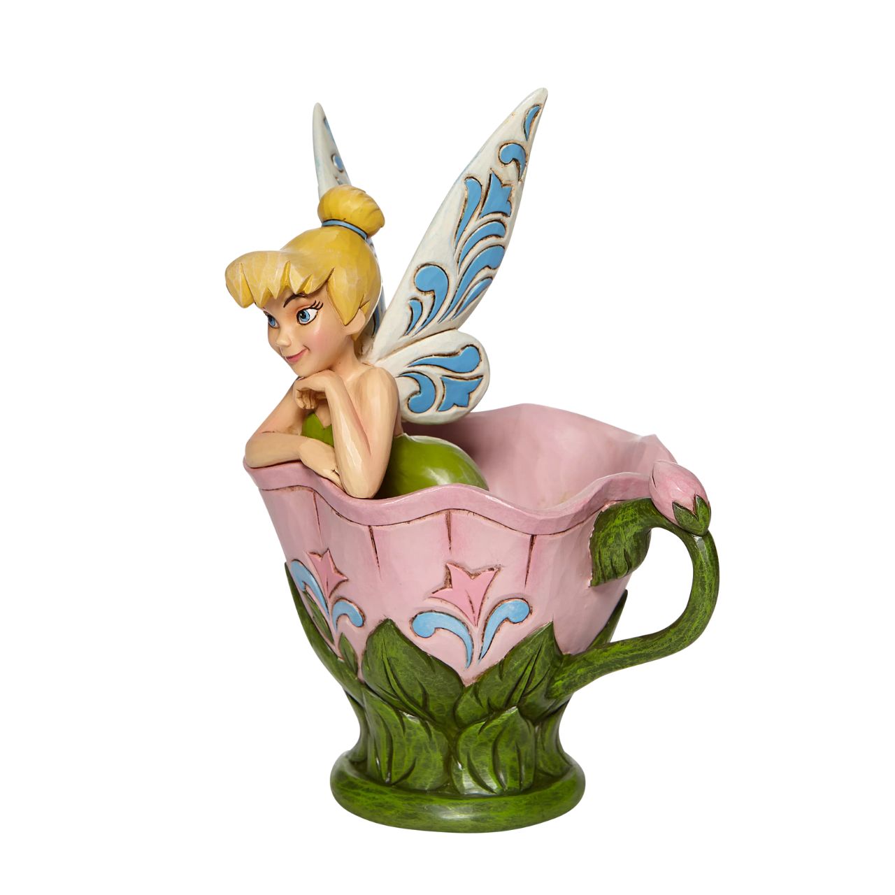 Disney Tinkerbell Sitting in a Flower Figurine A Spot of Tink by Jim Shore All the way from Neverland, this sweet and sassy fairy, takes a flower break before she's off on her next adventure. This Disney by Jim Shore piece is intricately hand sculpted and is great for any Tinker Bell enthusiast. Made from cast stone.