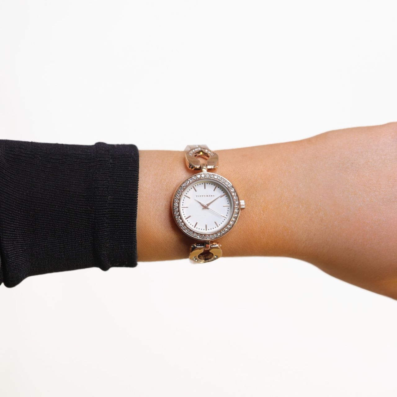 Crafted by the designers at Tipperary, the Everglow Rose Gold Watch is a radiant blend of modern elegance and feminine charm. Its polished rose gold-tone case is encircled by a delicate halo of silver crystals, framing a crisp white dial with refined rose gold detailing and minimalist hour markers.