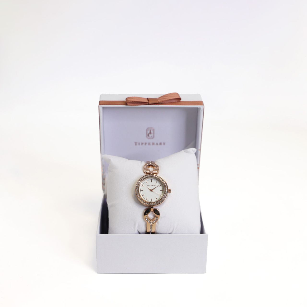Crafted by the designers at Tipperary, the Everglow Rose Gold Watch is a radiant blend of modern elegance and feminine charm. Its polished rose gold-tone case is encircled by a delicate halo of silver crystals, framing a crisp white dial with refined rose gold detailing and minimalist hour markers.
