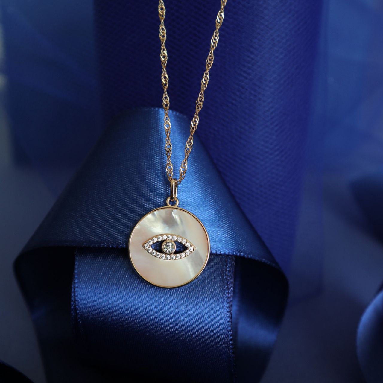 Elegant and meaningful, the Evil Eye Mother of Pearl Pendant is a timeless piece from the Evil Eye Collection, designed to blend beauty with symbolism. Representing protection and positivity, it’s the perfect necklace to wear close to your heart.
