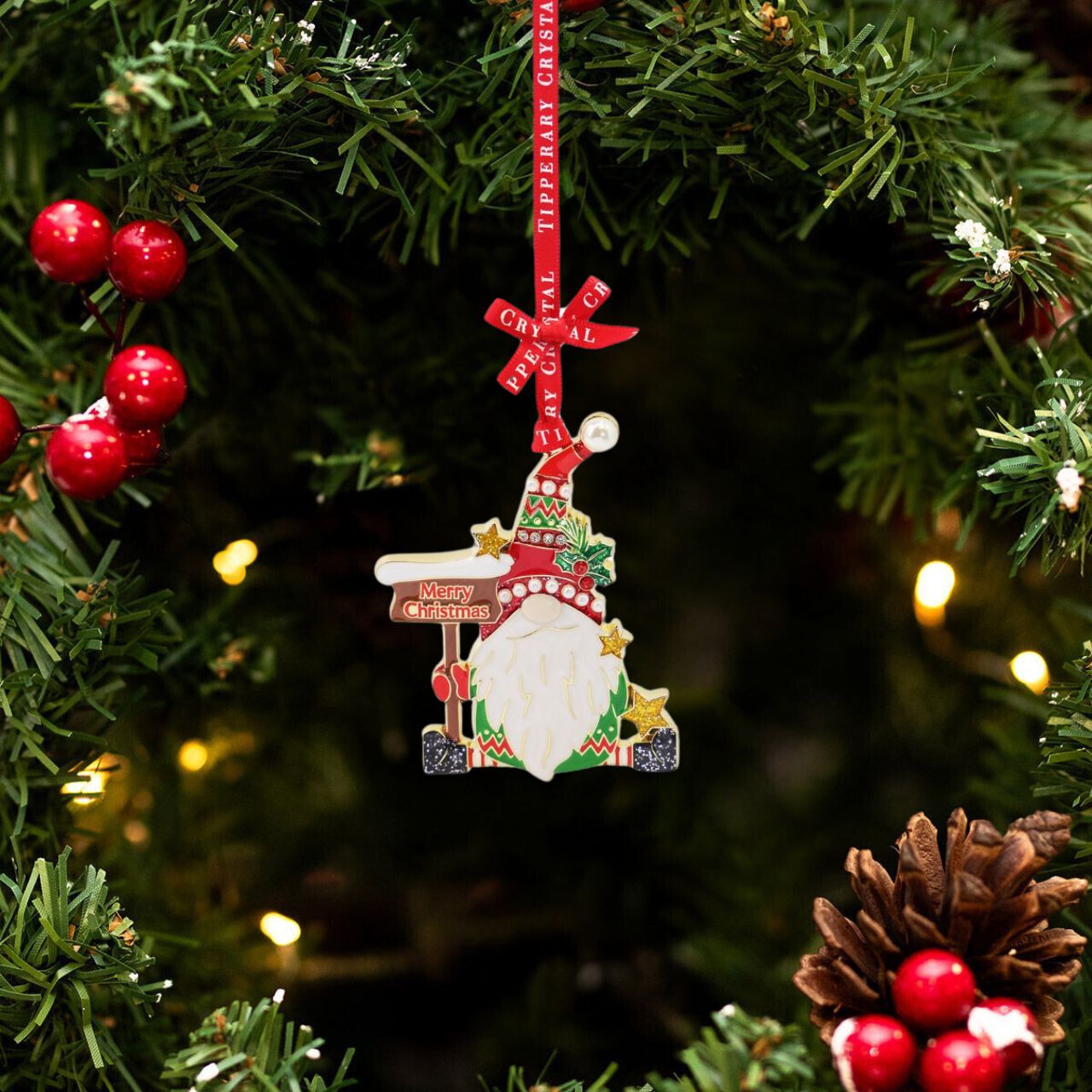 Introducing the festive and eye-catching Tipperary Gonk With Sign Sparkle Decoration! Expertly crafted with a sparkling Christmas sign, this unique gonk decoration is sure to add joy and cheer to your holiday décor. Made by Tipperary, a trusted brand known for their high-quality and creative decorations.