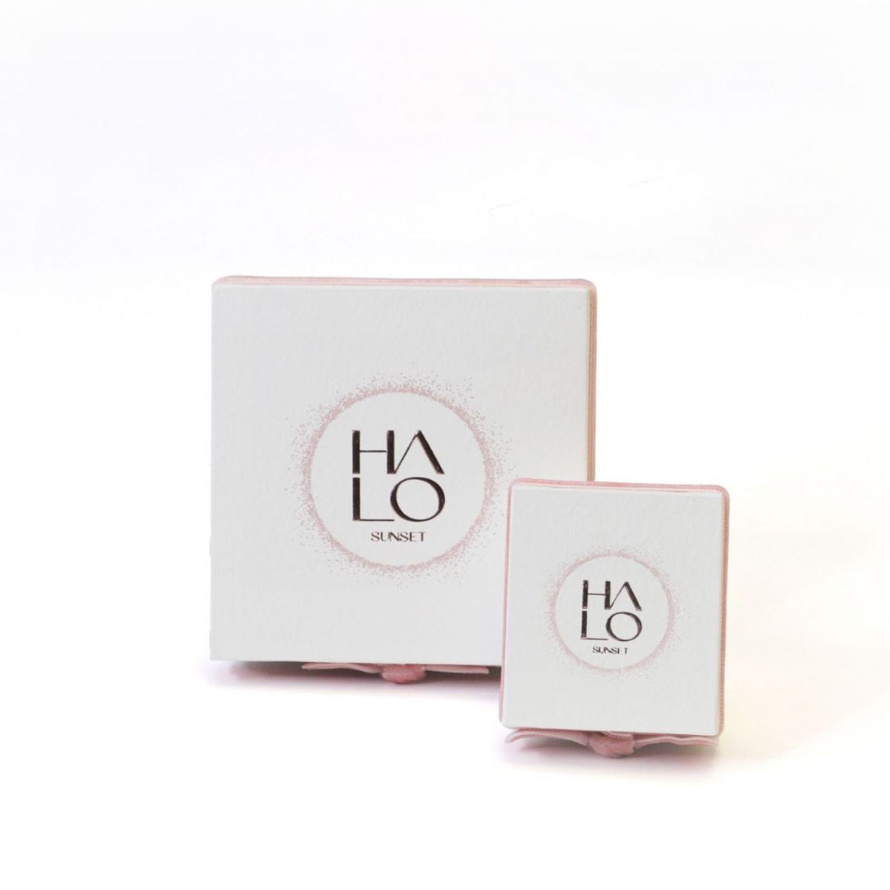 Expertly crafted with a touch of elegance, these Tipperary Rose Gold Hoop Earrings feature a beautiful Halo Sunset Mini Pink CZ design. Made with precision and quality, they add a touch of sophistication to any outfit. Upgrade your style with these stunning earrings.