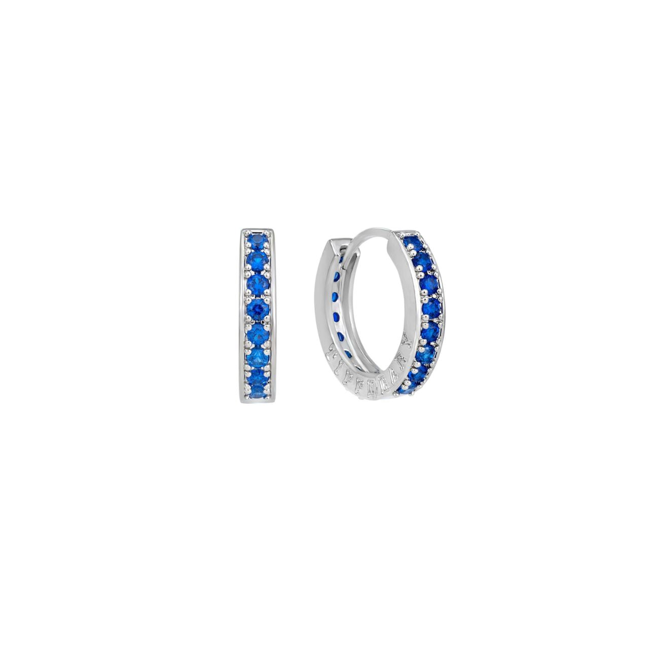Introducing the stunning Tipperary Halo Night Mini Blue CZ Hoop Earrings in Silver. These earrings feature a beautiful blue CZ stone and are expertly crafted to add a touch of elegance to any outfit.
