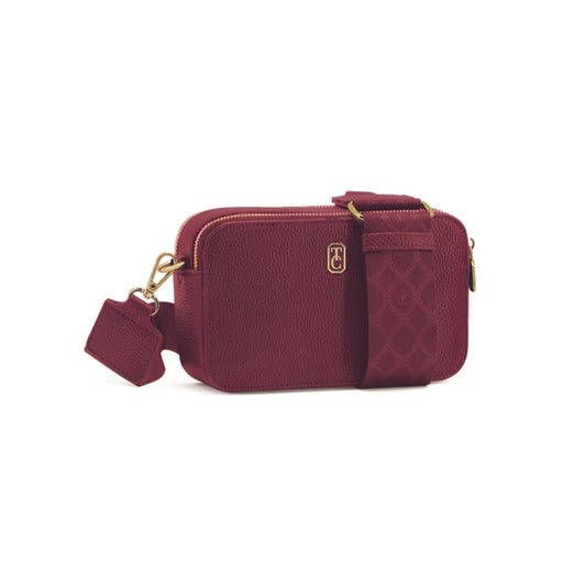 Expertly crafted by Tipperary, the Miami Mini Crossbody in elegant burgundy is the perfect accessory for any occasion. Featuring a convenient shoulder strap, this compact bag offers both style and functionality. Upgrade your wardrobe with this versatile and timeless piece.