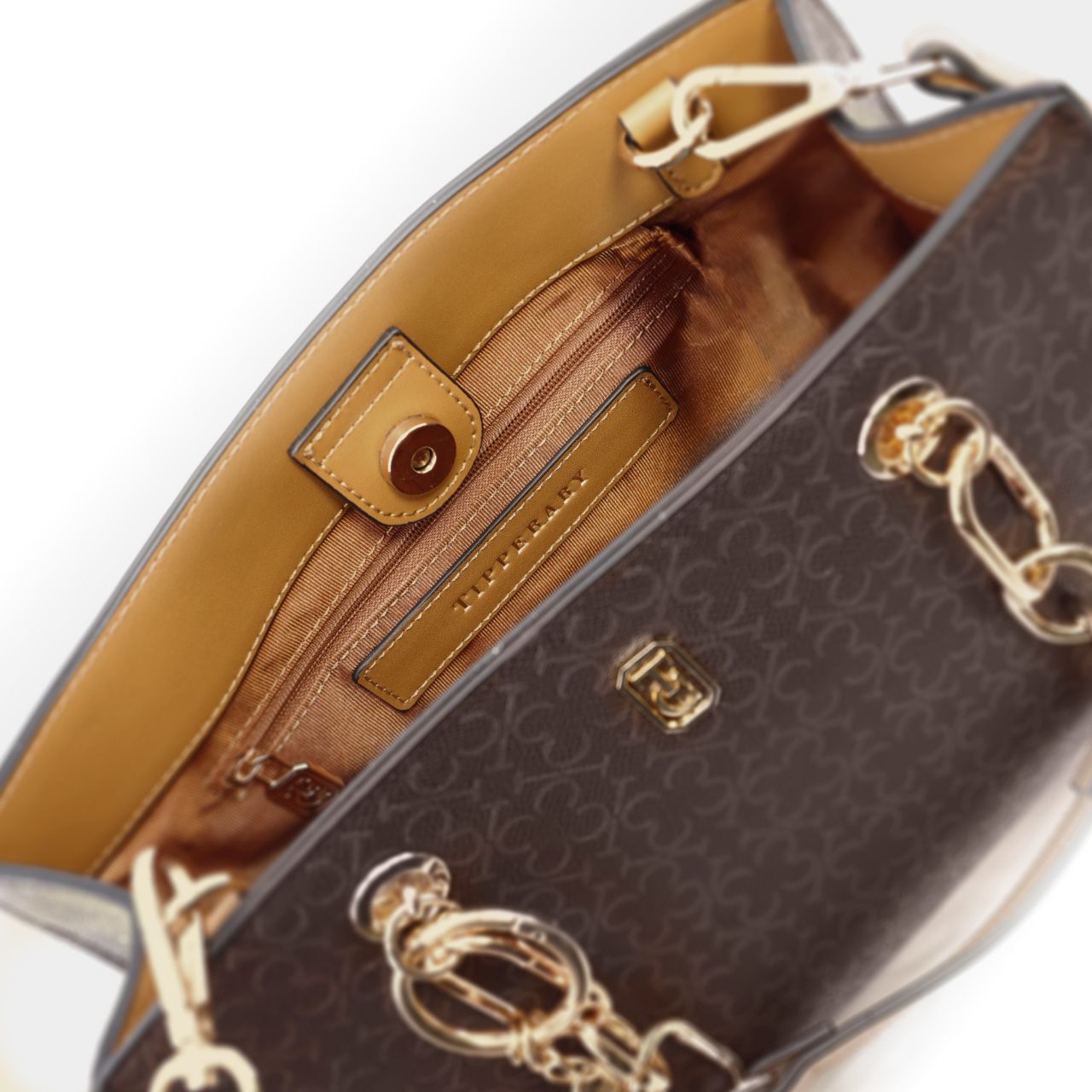 The Tipperary Monogram Handbag in Mocha is a sophisticated accessory designed for the discerning individual. Crafted with attention to detail, its monogram pattern adds a timeless elegance, while the rich mocha colour complements a variety of outfits.