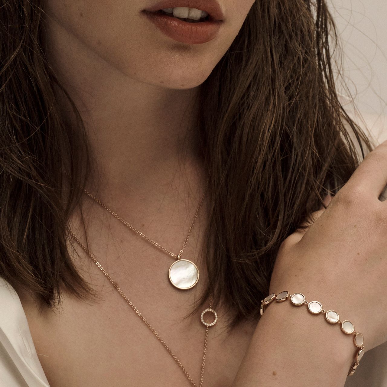 Mother Of Pearl Full Moon Bracelet by Tipperary This Bracelet is crafted from Rose gold and features fourteen perfectly round discs with a Mother of Pear inlay, this bracelet closes with a lobster clip and is finished with a TC Fob.