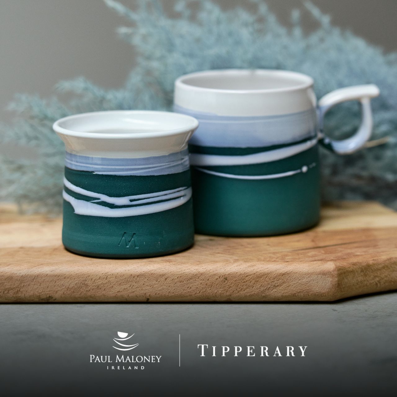 Tipperary Crystal Paul Maloney Pottery Teal Mug This Paul Maloney Pottery Teal Mug is the perfect way to enjoy your favourite hot beverage. Crafted by renowned potter Paul Maloney, this mug is made of durable and long-lasting clay, with a glazed teal finish that is sure to impress. Ideal for all kinds of hot drinks, this mug is sure to bring elegance to your morning routine.