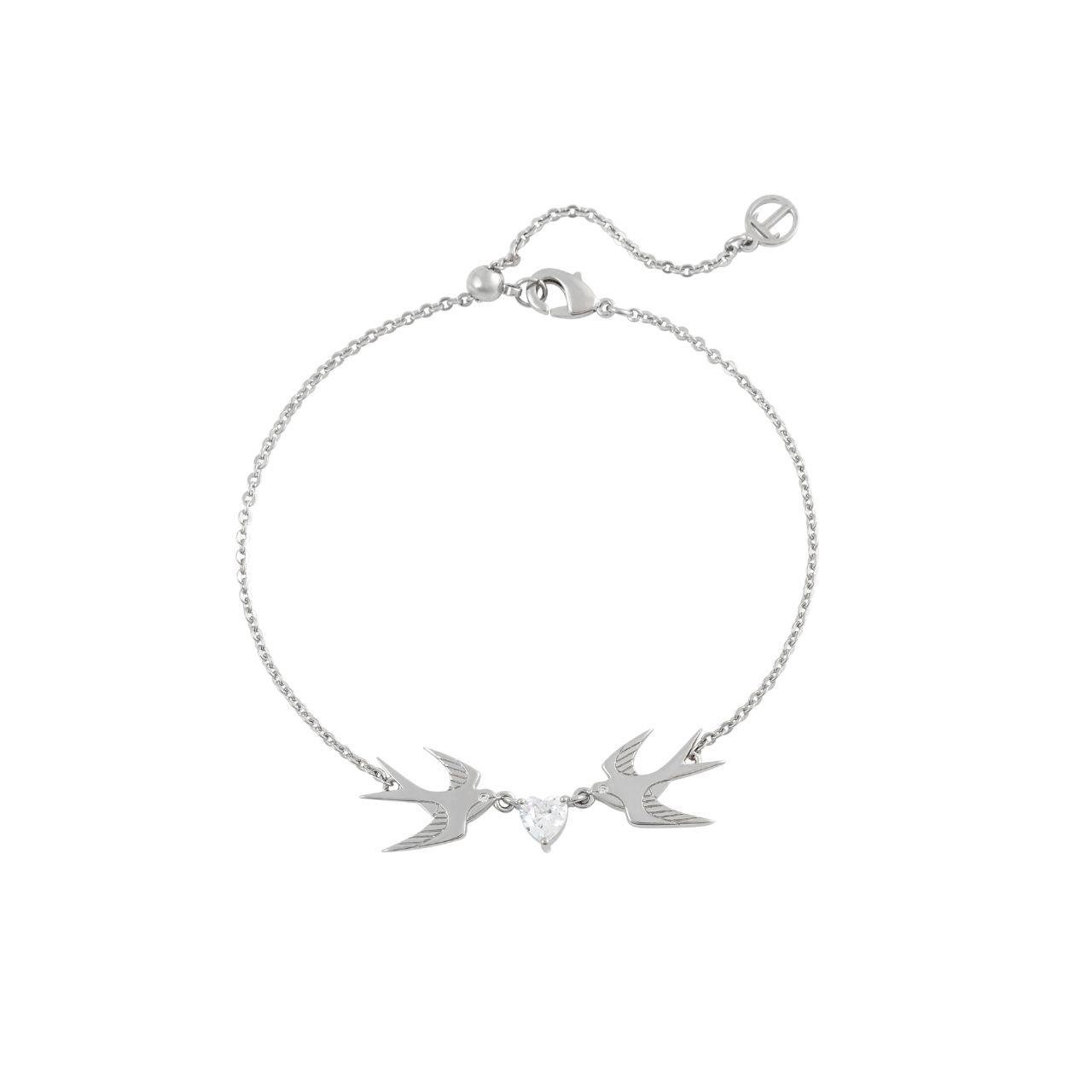 The Swallow Bracelet 2 Swallows and Heart CZ – Silver features two silver swallows gracefully flying toward a sparkling heart-shaped CZ crystal. This bracelet symbolizes love, freedom, and the beauty of connection. Its elegant design and shimmering heart add a touch of romance and sophistication, making it a perfect accessory for any occasion.