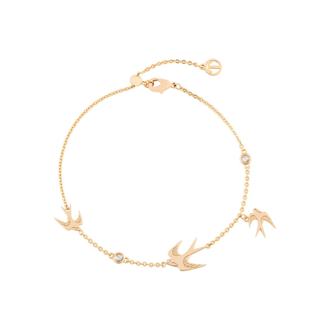 The Swallow Bracelet 3 Swallows & Clear CZ - Gold is a stunning piece that captures the essence of freedom and grace. This bracelet features three elegantly flying swallows, symbolizing the spirit of adventure and new beginnings.