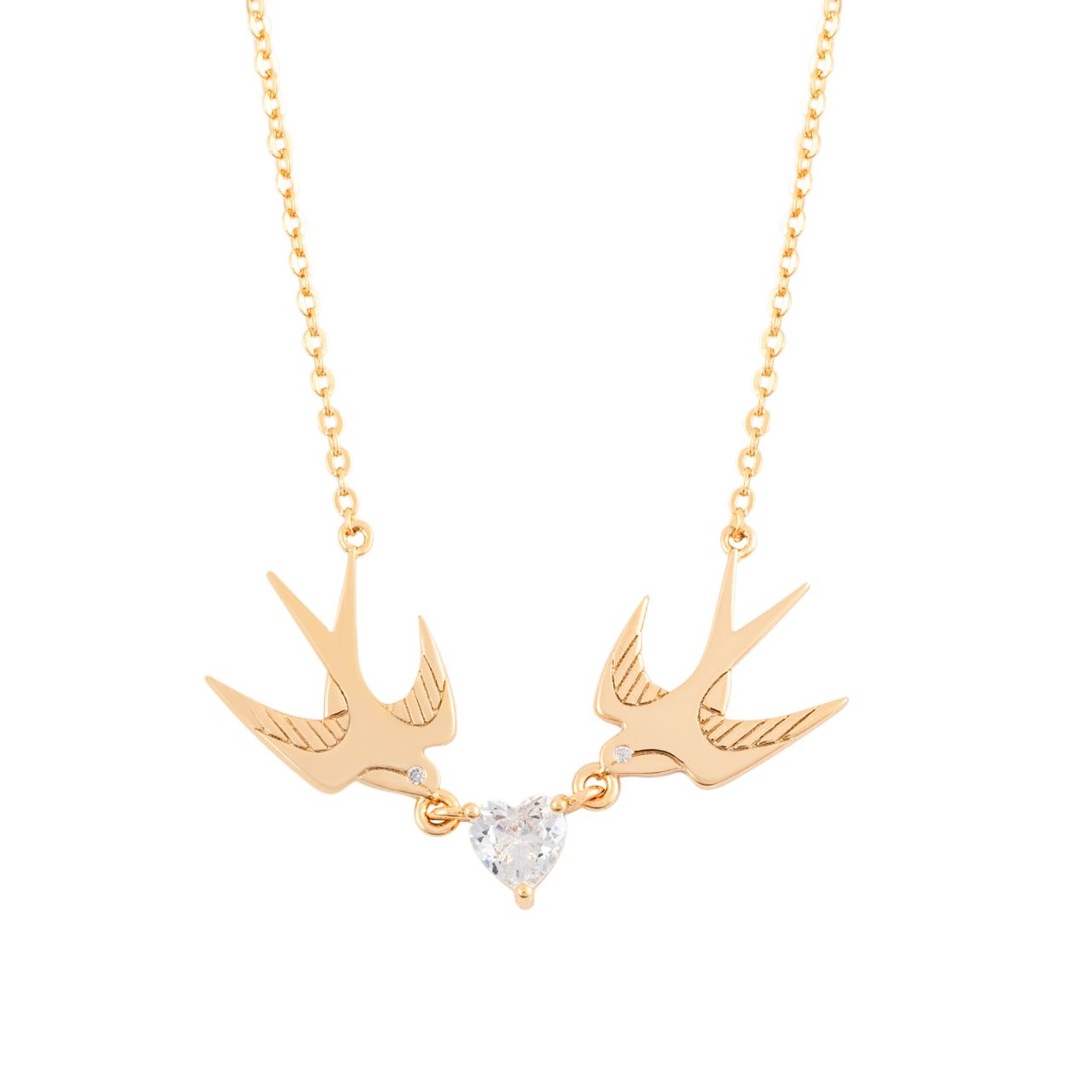 The Swallow Pendant 2 Swallows and Heart CZ – Gold showcases two gold swallows soaring towards a radiant heart-shaped CZ crystal. This pendant represents love, freedom, and the beauty of connection. With its graceful design and glimmering heart, it brings a sense of romance and elegance, making it an ideal accessory for any special occasion.