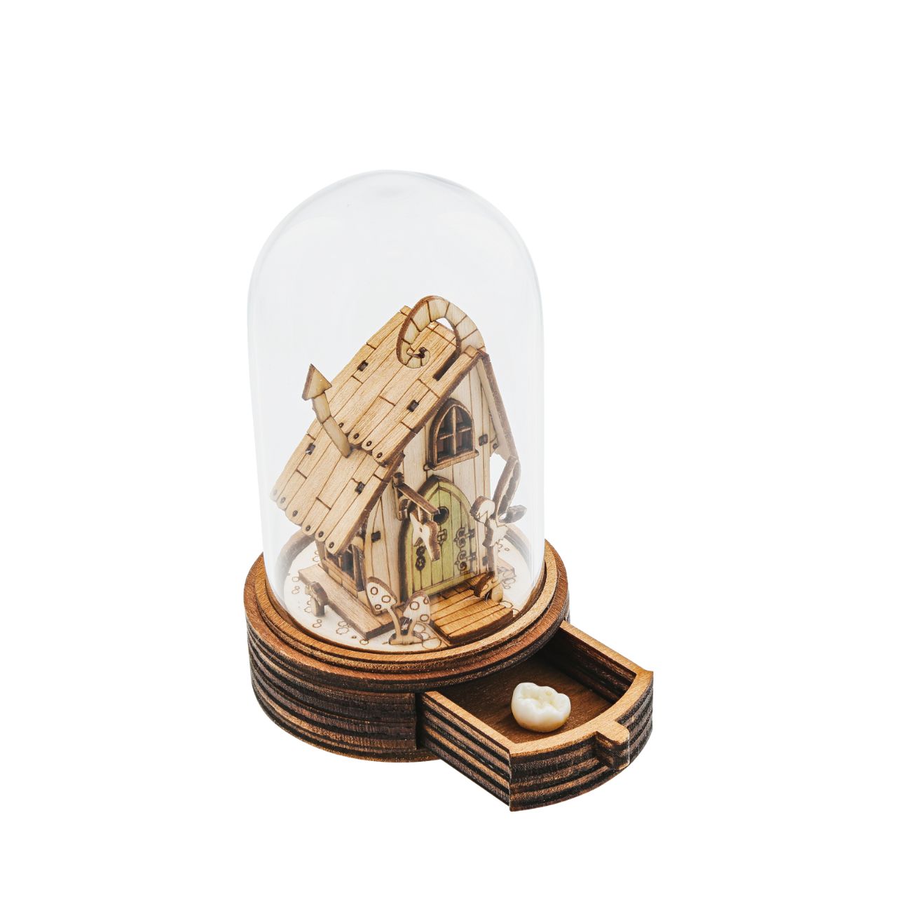 Everyone knows the story of the Tooth Fairy and now Kloche has a new way to bring that magic to your children. This glass dome decoration encases a detailed miniature of the Tooth Fairy themself in front of their Fairy home. What sets this apart from other pieces in the collection, is the little drawer built into the bottom, the perfect size for those lost teeth or a little treat from the Fairy.
