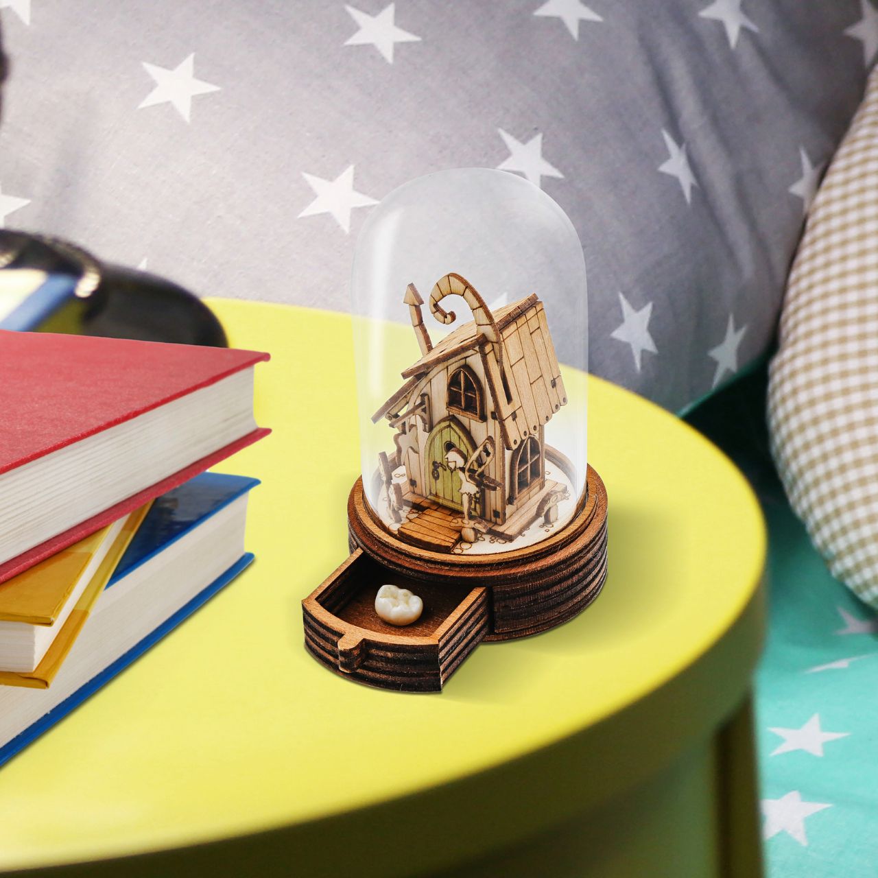 Everyone knows the story of the Tooth Fairy and now Kloche has a new way to bring that magic to your children. This glass dome decoration encases a detailed miniature of the Tooth Fairy themself in front of their Fairy home. What sets this apart from other pieces in the collection, is the little drawer built into the bottom, the perfect size for those lost teeth or a little treat from the Fairy.