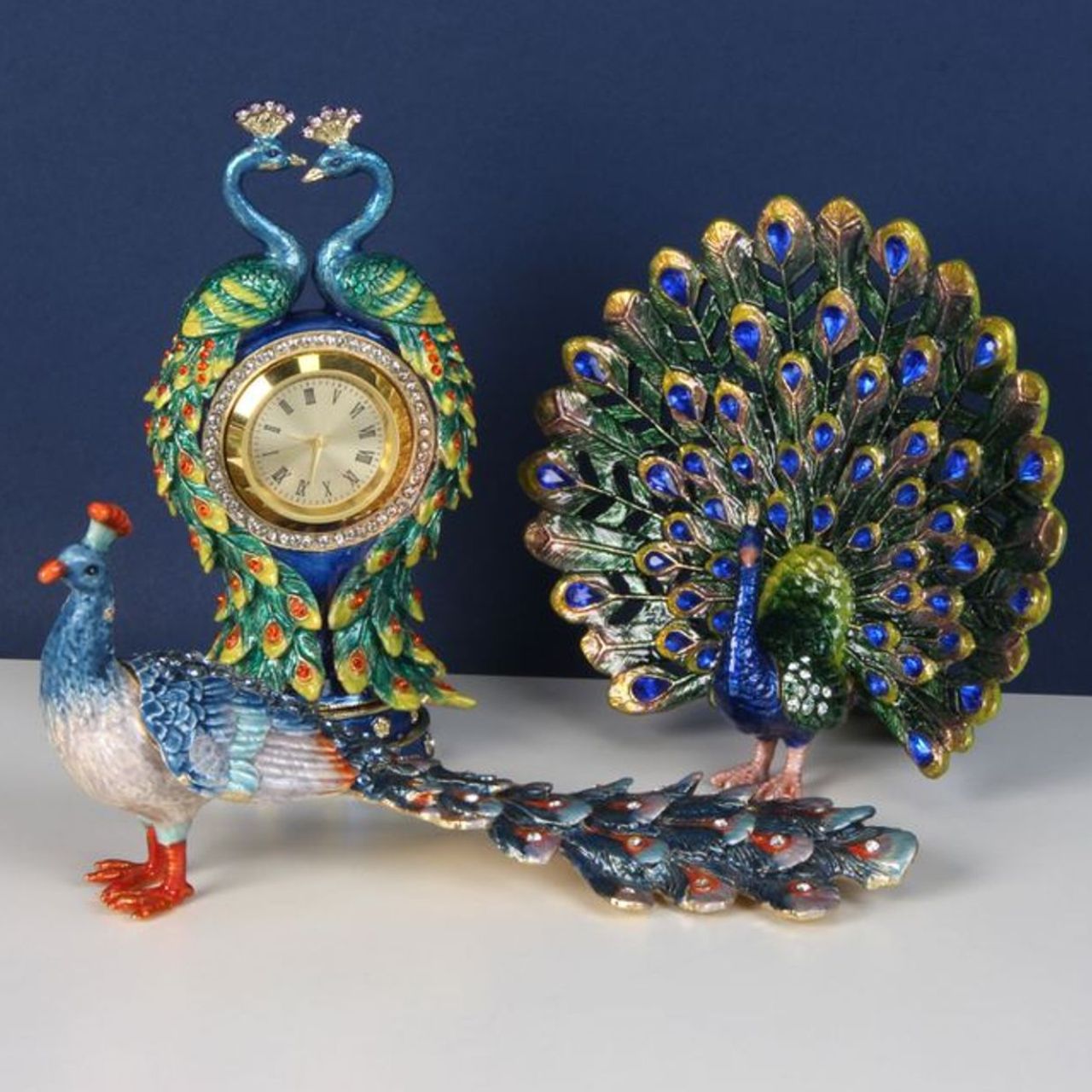 Painted in the glorious colours of a Peacock and its plumage, this peacock trinket with adorned with blue crystals that finish this wonderful ornament perfectly.