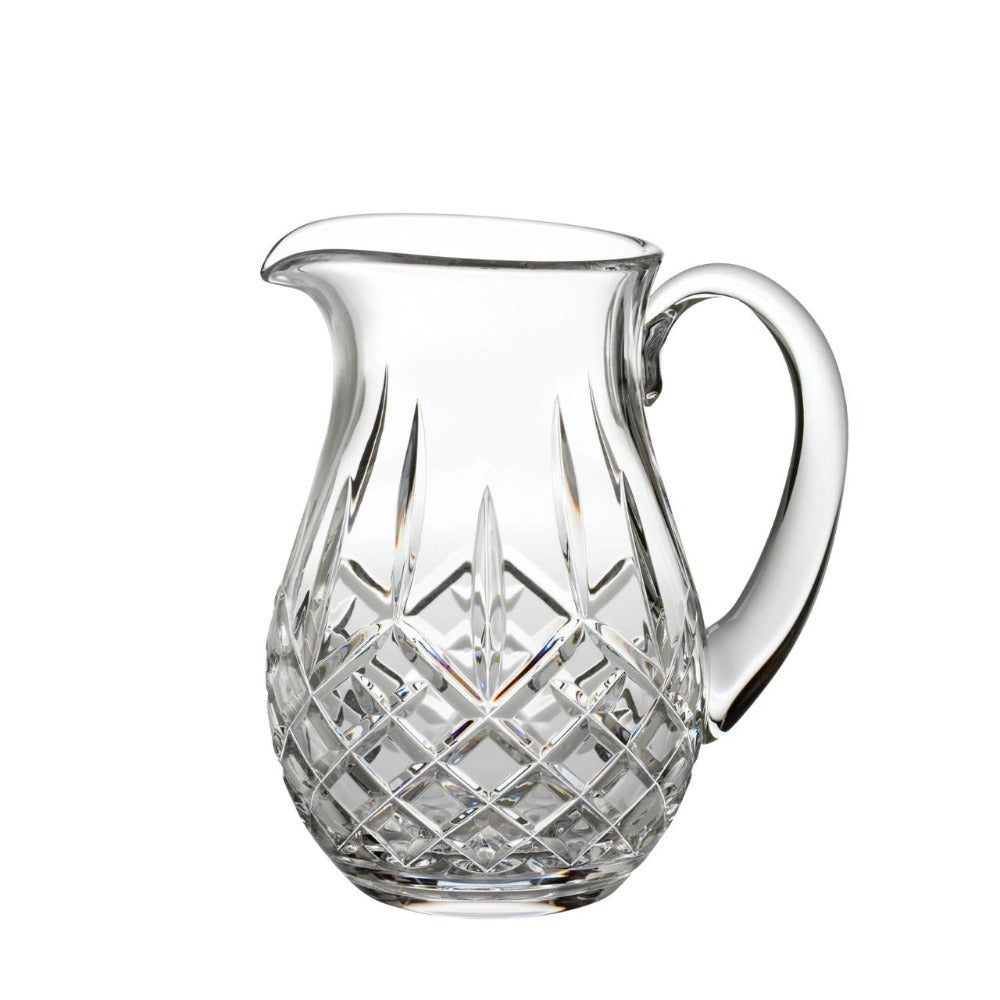 Waterford Lismore Pitcher  This elegant Lismore Pitcher brings luxury style to entertaining at home, as you confidently pour homemade lemonade, iced water or a refreshing fruit punch for welcome guests. Crafted from the finest crystal, this generously proportioned jug pitcher has a reassuring weight and sturdy handle that makes pouring the perfect serving simply effortless.