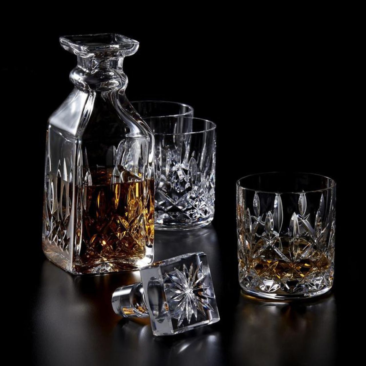 Waterford Crystal Lismore Square Decanter Proudly pour your favourite single malt from this charming Lismore 26oz Square Decanter and become a connoisseur. With its striking square profile, this traditional crystal whiskey decanter will look magnificent as it highlights the rich colour of its contents, radiating luxury and excellence as you entertain guests or savour something that is too good to share.