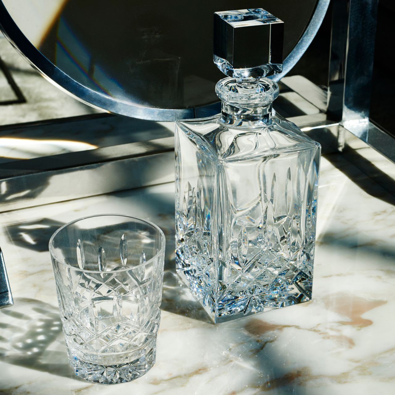 Waterford Crystal Lismore Square Decanter Proudly pour your favourite single malt from this charming Lismore 26oz Square Decanter and become a connoisseur. With its striking square profile, this traditional crystal whiskey decanter will look magnificent as it highlights the rich colour of its contents, radiating luxury and excellence as you entertain guests or savour something that is too good to share.