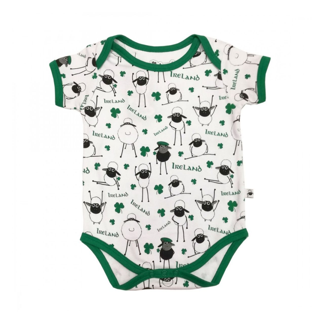 White & Green Overall Printed Sheep Baby Vest This white and green baby vest is part of the Traditional Craft Official Collection. This white cotton vest has an emerald green trim on the neck, sleeves and bottom. The vest is designed with an over all print of sheep, shamrocks & Ireland logo's from the Flaherty Flock range.